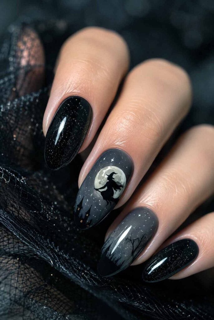 A woman's hand with a Halloween manicure, a witch silhouette against a full moon