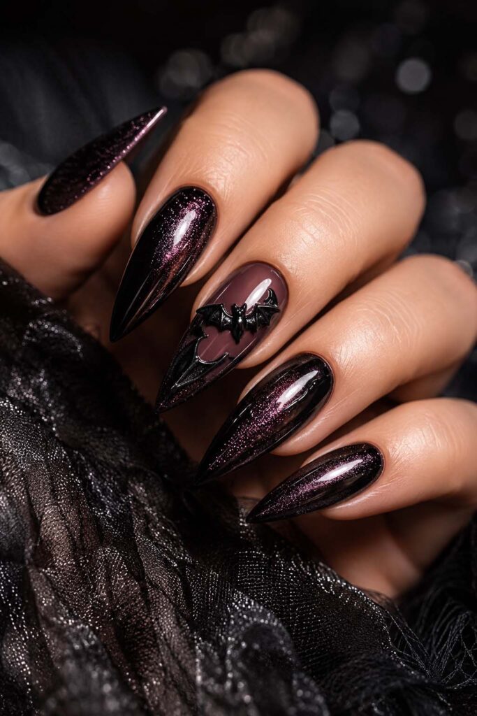 A woman's hand with a Halloween manicure. 3D relief bat.
